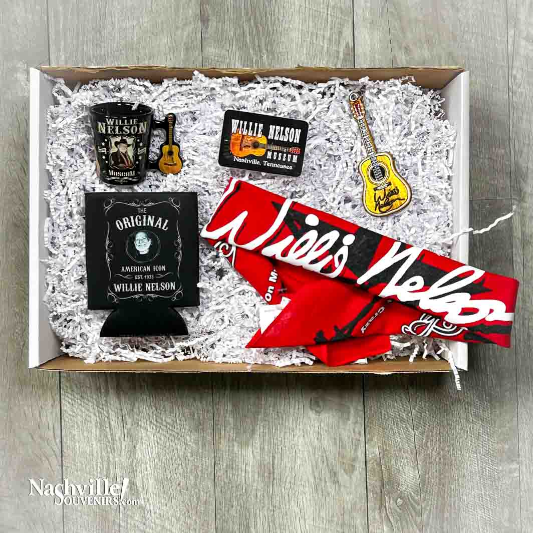 Here's a great gift idea for the Willie Nelson fan in your life. This collection includes the following items: Willie Nelson Museum Shot Glass American Icon Koozie Willie Nelson Museum Sticker Willie Nelson Museum Trigger Key Chain Willie Nelson signature bandana Items are shipped in a white gift box with shred.