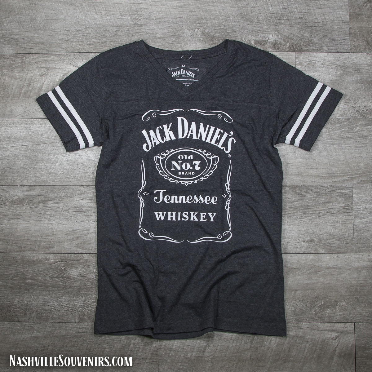 Officially licensed ladies Jack Daniels Bottle Label V-neck Jersey T-Shirt in charcoal gray with Bottle Label Logo. Get yours today with FREE SHIPPING on all US orders over $75!