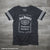 Officially licensed ladies Jack Daniels Bottle Label V-neck Jersey T-Shirt in charcoal gray with Bottle Label Logo. Get yours today with FREE SHIPPING on all US orders over $75!