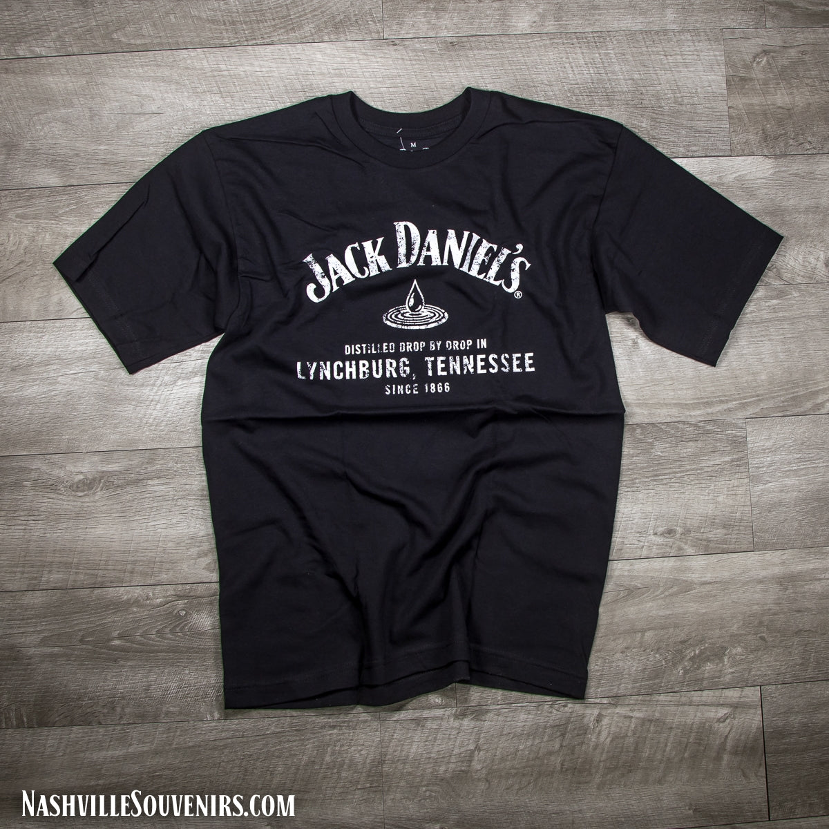 Officially licensed Jack Daniels Lynchburg Tennessee Drop T-Shirt in black reading distilled drop by drop in Lynchburg, TN. Get yours with FREE SHIPPING on all US orders over $75!