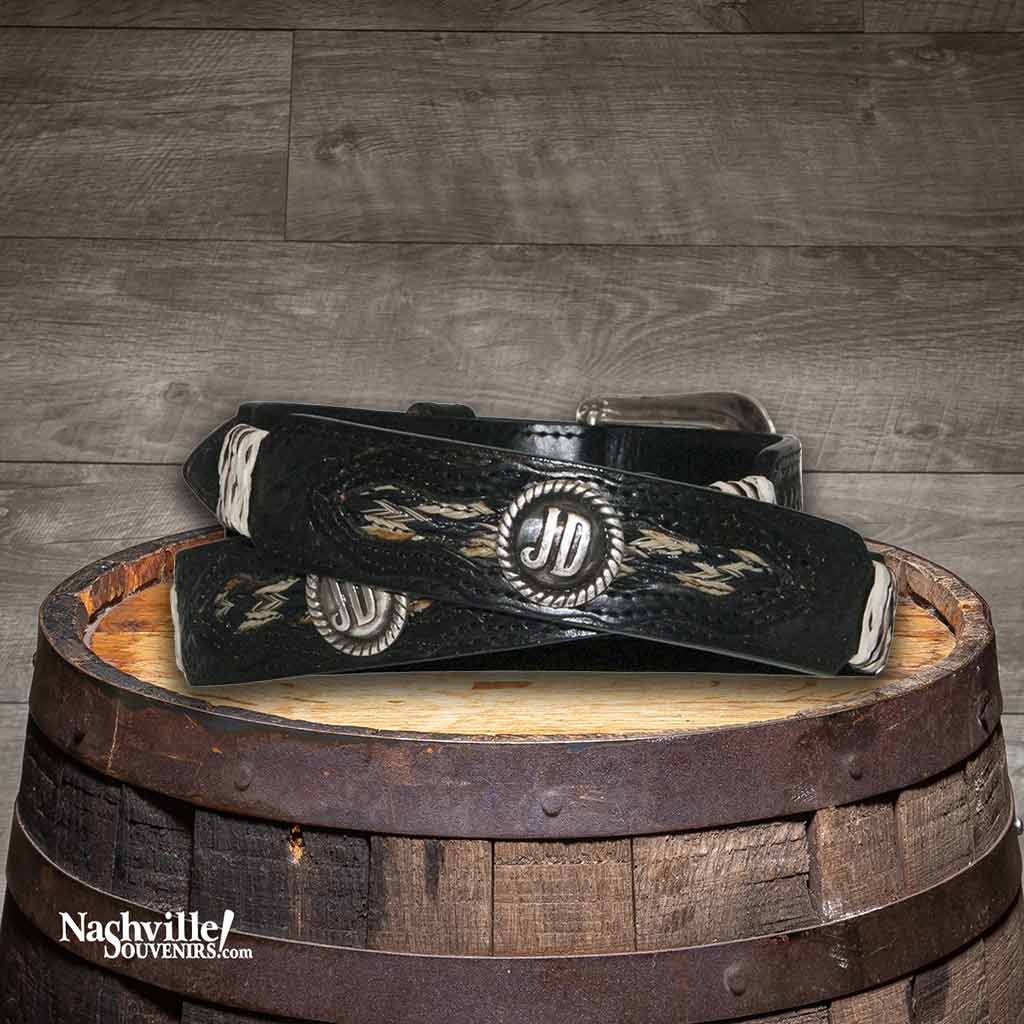 Hip view of a Jack Daniel's Basket weave and Rawhide belt featuring basket weave and rawhide detailing along with JD conchos and silver Jack Daniel's buckle.