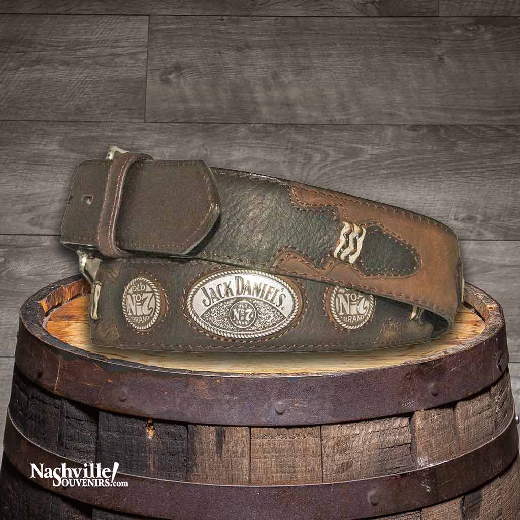 Hip view of a Jack Daniel's Rawhide Knot Western Belt with billets, Jack Daniel's conchos and a silver plated Jack Daniel's buckle in brown full grain leather.