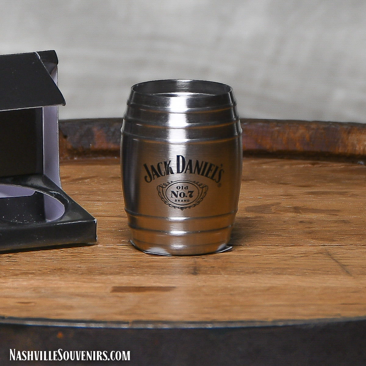 Description 2 oz Officially licensed Jack Daniels Barrel Shot Glass featuring the Jack Daniel's Swing and Cartouche logo.  These stainless steel double jiggers have laser etched lines at 1 ounce and 2 ounce to insure an accurate pour every time.