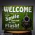 WELCOME now Smile and wait for the Flash! Tin Sign
