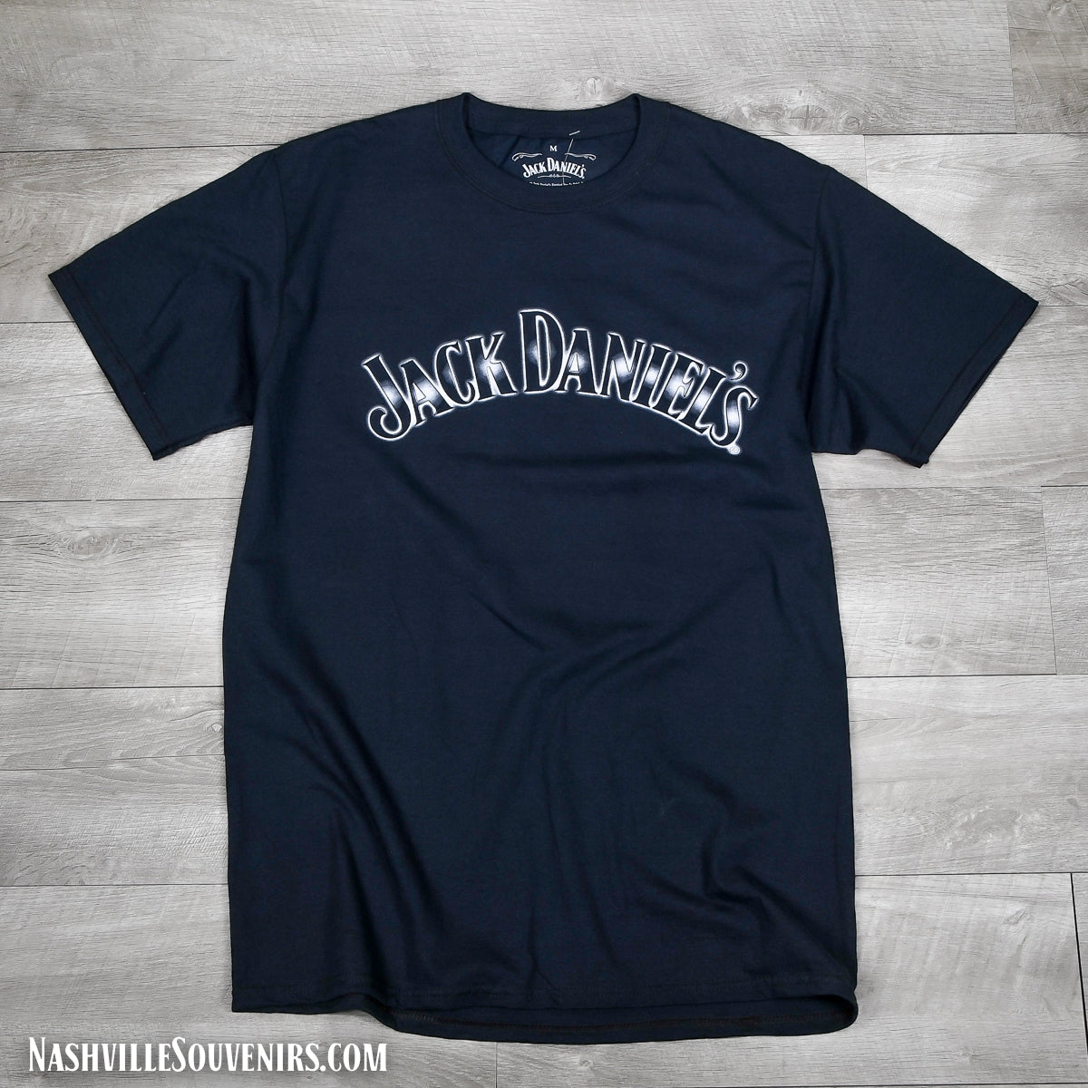 This officially licensed Jack Daniels Bottles T-shirt has a arched Jack Daniels name on the front with three whiskey bottles of Jack on the back. FREE SHIPPING on all US orders over $75!