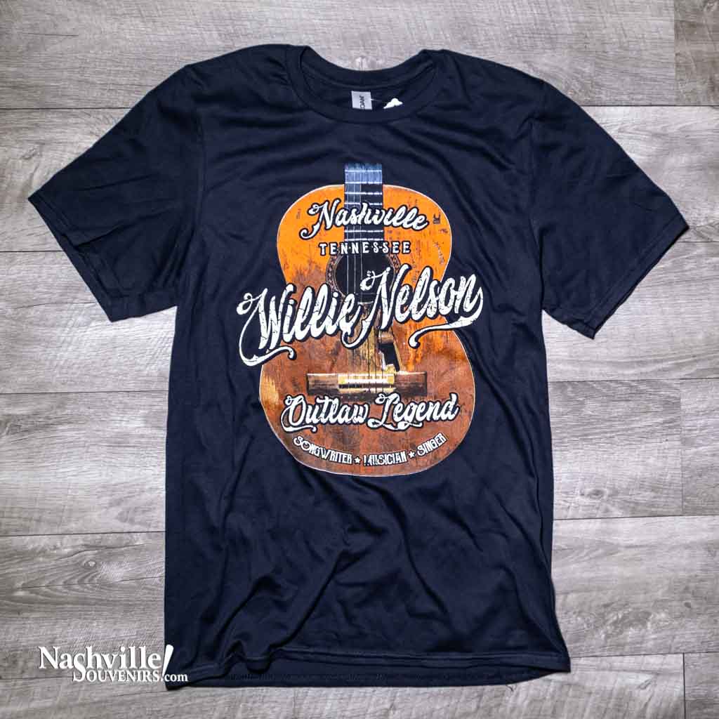 A new Nashville design featuring Willie's guitar "Trigger" in the background. Overlaid on the guitar you'll notice a big "willie Nelson" with Nashville above and "Songwriter, Musician and Singer" below.  This unisex Willie Nelson t-shirt comes in black and is available in sizes Small, Medium, Large, X-Large, 2X and 3X.  