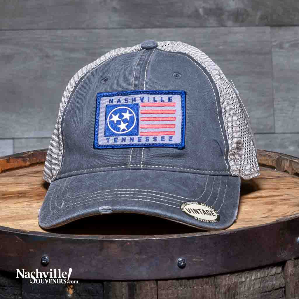 This Tri Star Nashville Tennessee Trucker Hat features a rectangular patch with an embroidered TN state flag along with the iconic Three Stars and Nashville Tennessee in Navy stitching.