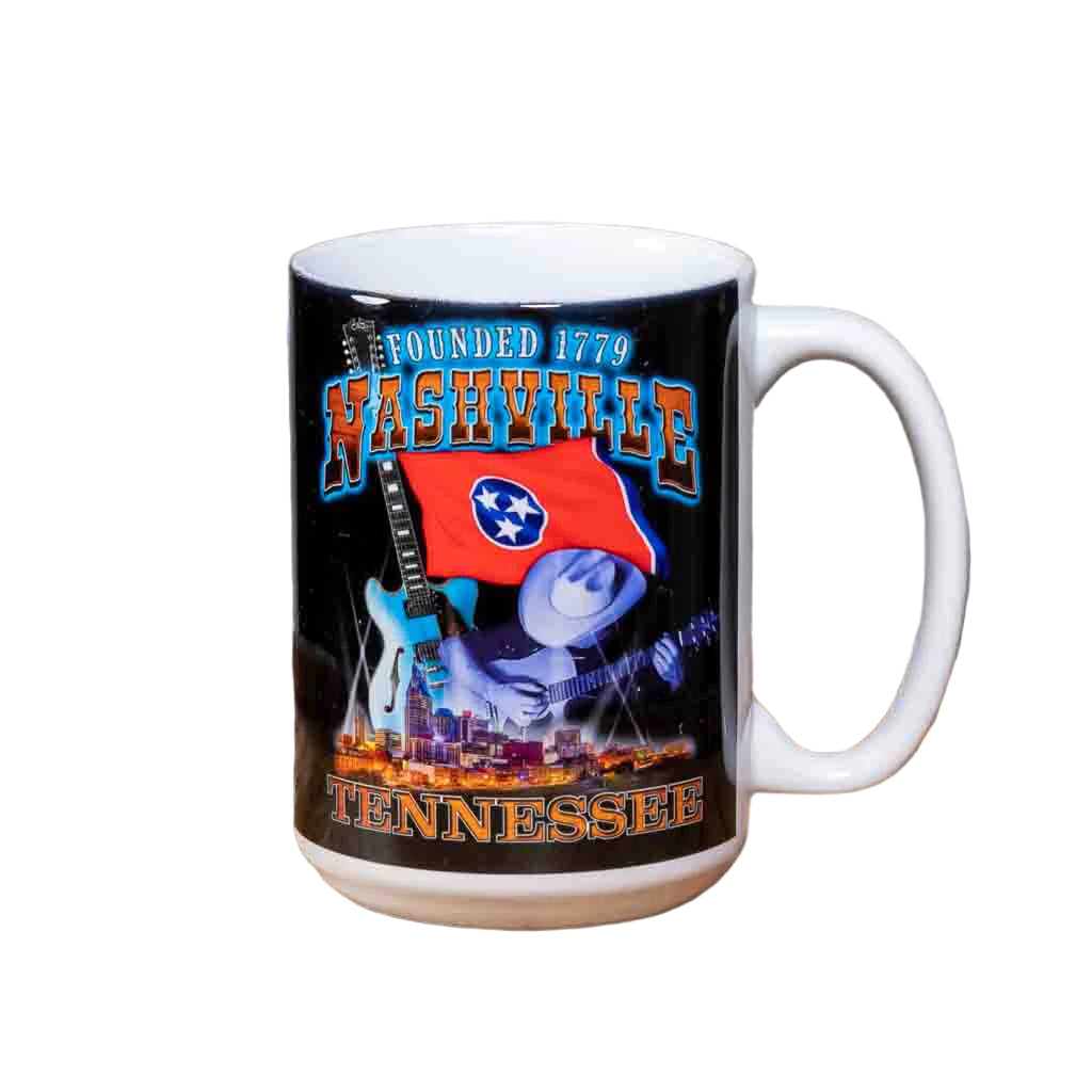 This "Founded 1779" Nashville Coffee Mug is a white ceramic mug with an easy to grip handle. The mug features a two sided colorful design that includes images of the TN state flag, downtown Nashville and a picker playing an acoustic guitar.