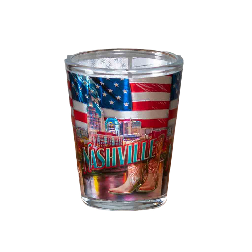 A new design Nashville Skyline and Flag Shot Glass printed with a colorful and scenic background of Nashville, TN with the American flag above.