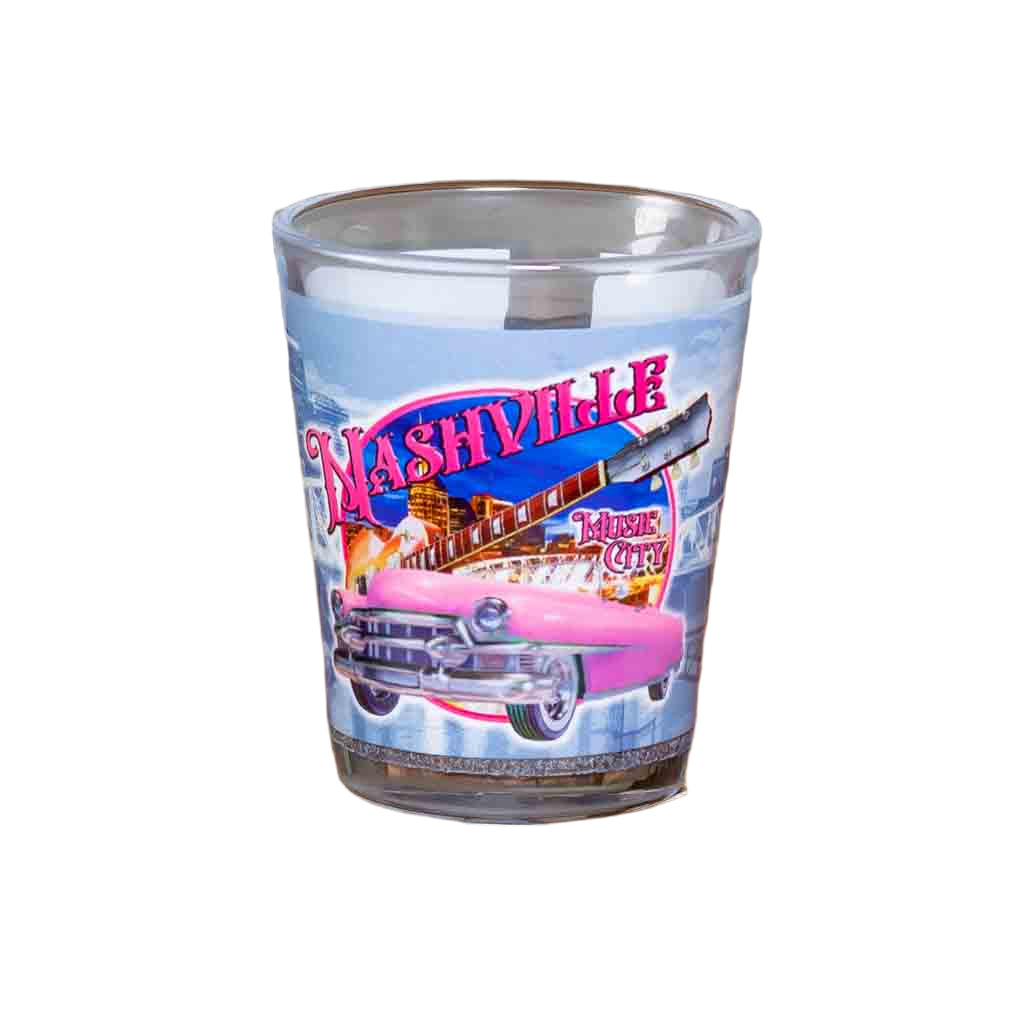 A new Nashville Pink Cadillac Shot Glass printed with a colorful and scenic design incorporating a pink Cadillac, Guitar and downtown Nashville.