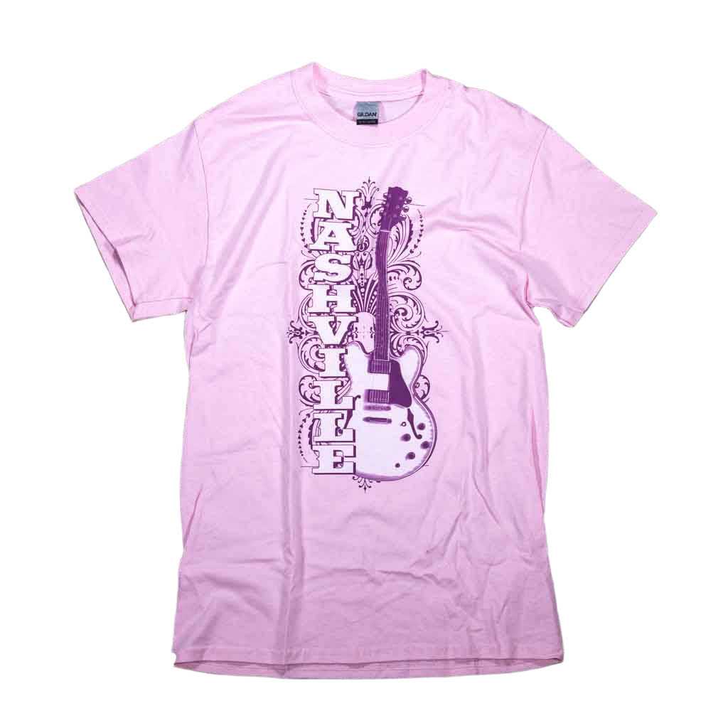 A pink Nashville Guitar t-shirts feature a large Nashville alongside an electric guitar. There is a nice filigree pattern in the background as well.