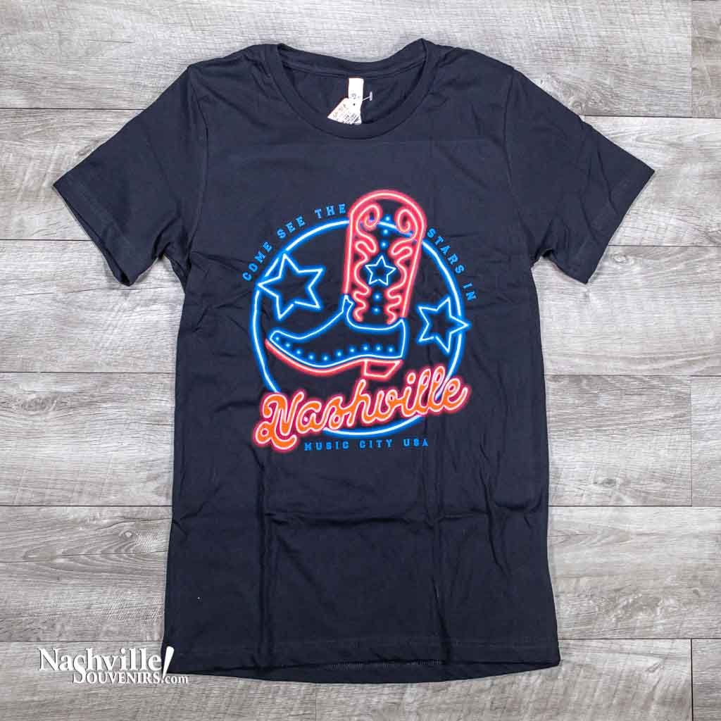 A new design "See the Stars in Nashville" while wearing this t-shirt.  These great new t-shirts feature a neon look multicolor logo with a big cowboy boot in the center and "Nashville Music City USA" below.