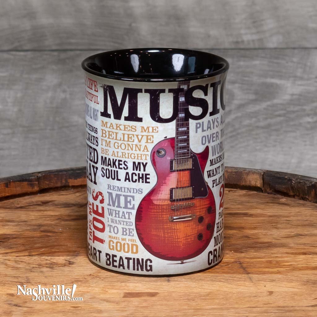 Front view of a great new mug design that sings the praises of Music. The "Music Inspires Me" Guitar Coffee Mug is big and easy to grip. This mug design features a beautiful multi-color design that includes all types of descriptions about the power of music. The handle features a full color electric guitar.