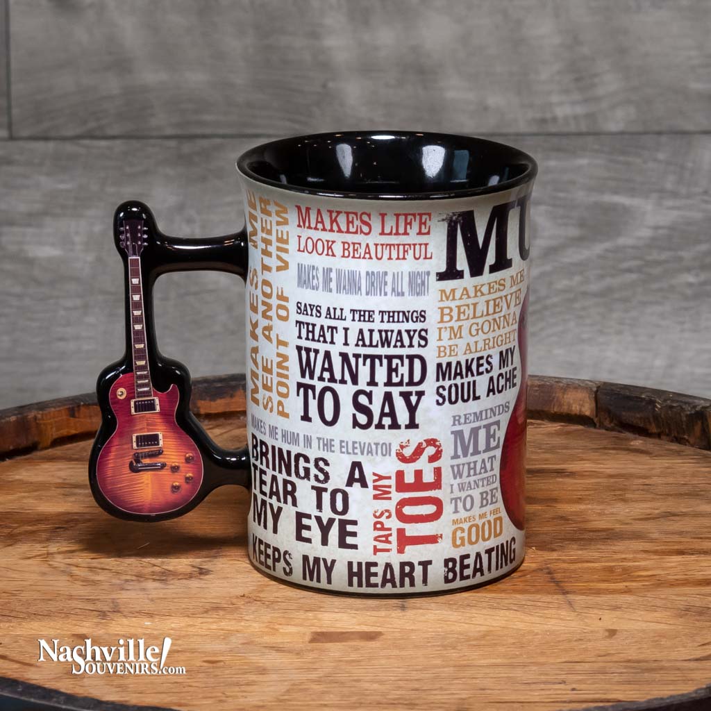 Left side view of a great new mug design that sings the praises of Music. The "Music Inspires Me" Guitar Coffee Mug is big and easy to grip. This mug design features a beautiful multi-color design that includes all types of descriptions about the power of music. The handle features a full color electric guitar.