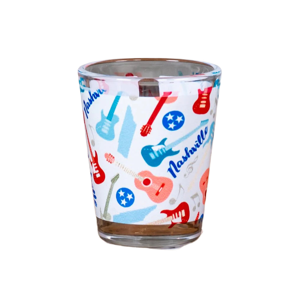 This Nashville Guitars Shot Glass features a full wrap image that includes multiple guitars and the words Nashville.