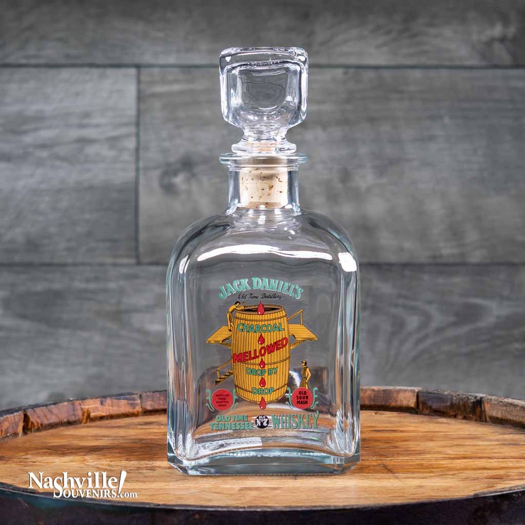 Officially licensed vintage Vintage Jack Daniel's "Charcoal Mellowed Whiskey" Decanter is one of several new decanter designs. This decanter features the multi color logo design with images from the barrel, barrel house and distillery in Lynchburg, TN.