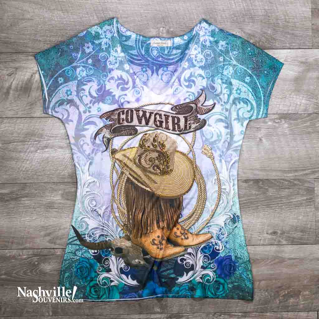 Our new women's Women's "Cowgirl" Boots and Hat Shirt is extremely comfortable and made from a soft polyester material and that women just love.  This beautiful shirt features a "Cowgirl" logo in a design that that includes cowgirl boots and hat framed in a rope design. 