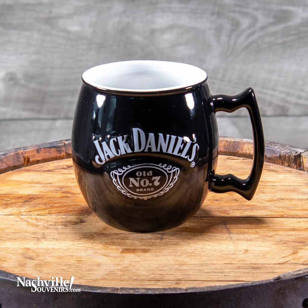 Officially licensed Jack Daniels "Swing and Cartouche" Logo Coffee Mug. Enjoy your morning in style with this beefy, high quality JD mug. This Jack Daniel's mug boasts the Swing and Cartouche Logo design in white.
