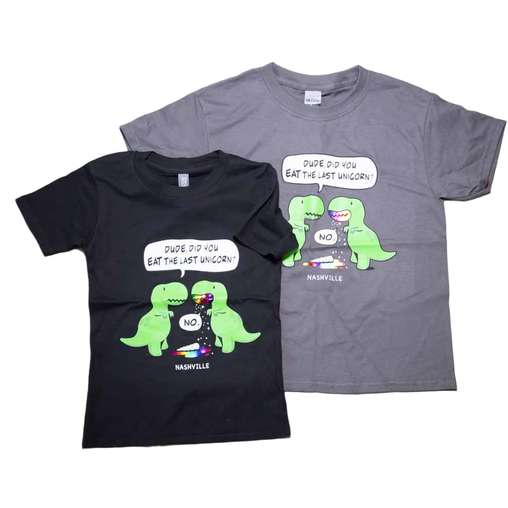 Black and Charcoal gray kids youth "Last Unicorn Nashville" T-Shirt features a colorful logo that includes two dinosaurs discussing the mysterious demise of the last unicorn! Beneath the dinosaurs you'll find "Nashville"