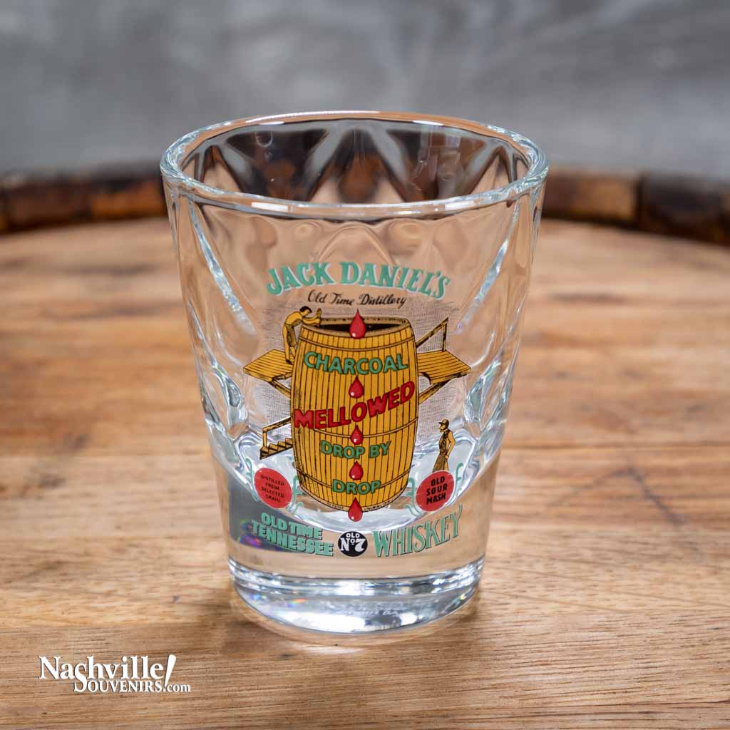 Close up view of an Officially licensed vintage Jack Daniel's "Charcoal Mellowed" shot glass is perfect for serving your favorite drink. This new Jack Daniel's glass is one of a series of JD collector shot glasses that feature exact reproductions of vintage Jack Daniel's logos used by the company on their products in days gone by.