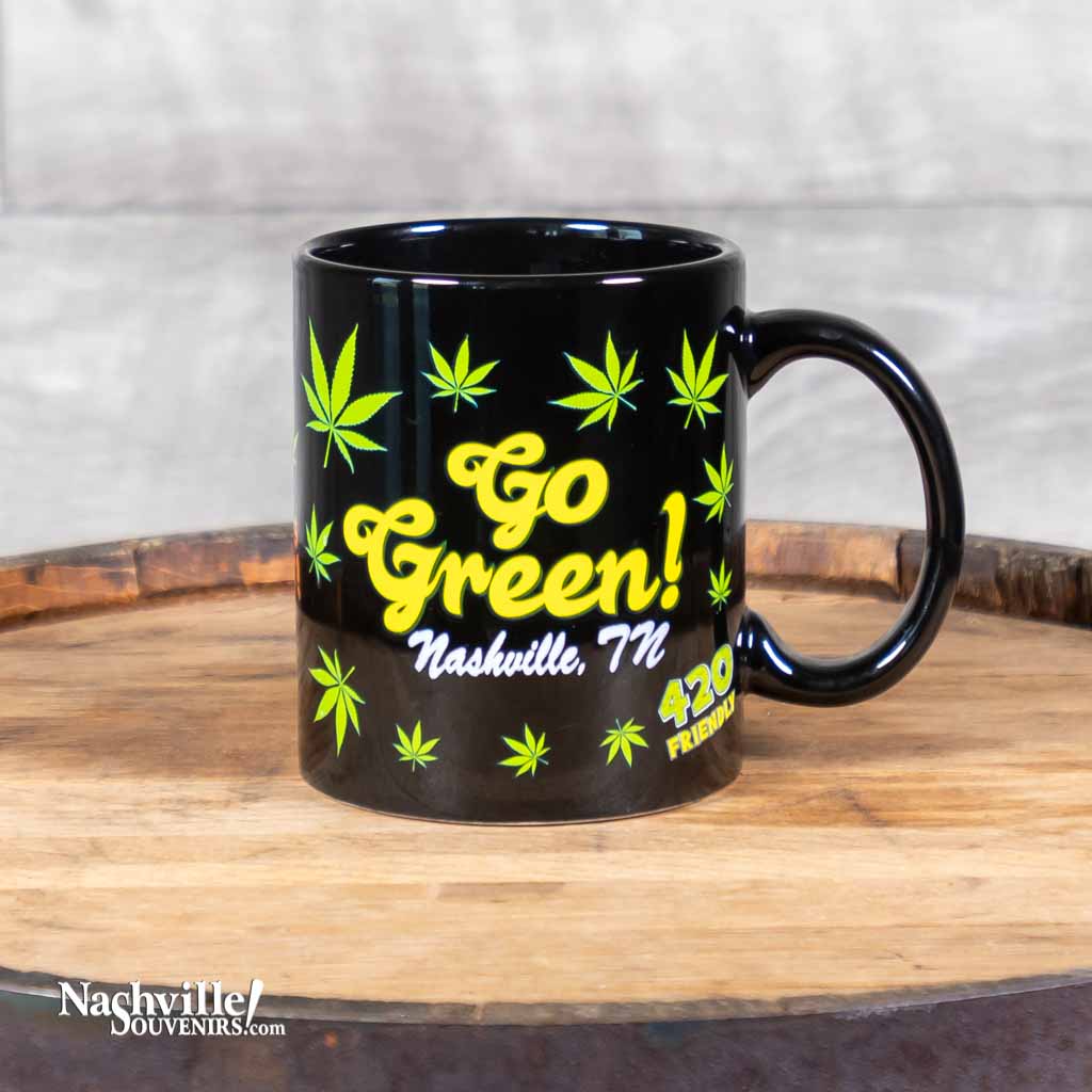 A new mug design, our "Go Green" Nashville TN Coffee Mug is one of many items you'll find in Willie's "Green Room" collection of cannabis, pot and 420 friendly inspired gifts and souvenirs. The mug is 3 3/4" high and holds approximately 12 ounces.