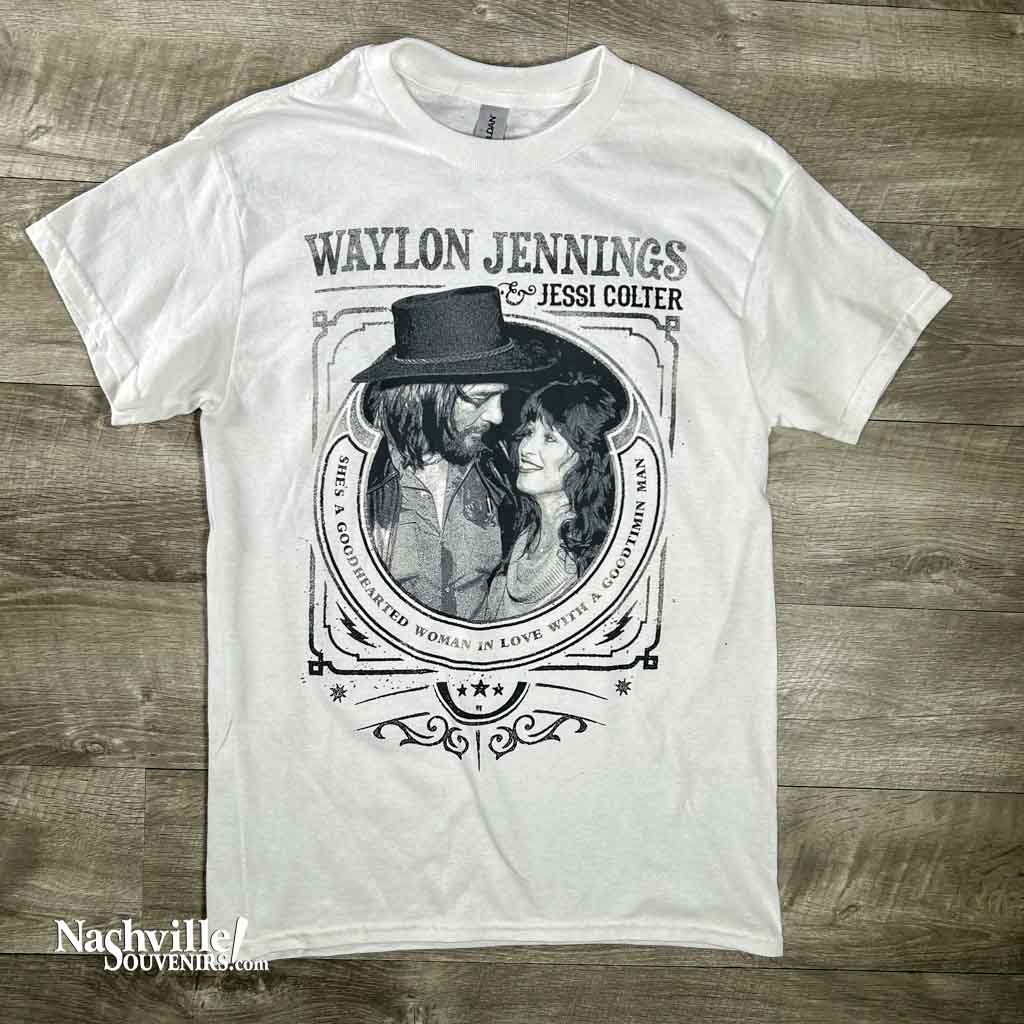 This is a brand new Waylon Jennings T-shirt design featuring a great image of Waylon looking into the eyes of Jessi Colter. Above Waylon's image it says, "Waylon Jennings & Jessi Colter" and below the image says "She's a good hearted woman in love with a good timin man". 
