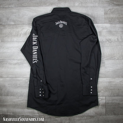 Jack Daniels officially licensed long sleeve black Western Rodeo Shirt featuring a large, bright white embroidered Jack Daniels logo on one sleeve along with the swing and cartouche label embroidered on the front left chest area.