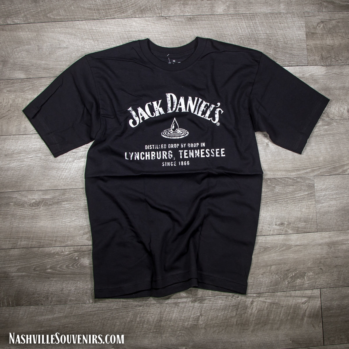 Officially licensed Jack Daniels Lynchburg Tennessee Drop T-Shirt in black reading distilled drop by drop in Lynchburg, TN.  Get yours with FREE SHIPPING on all US orders over $75!