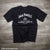 Officially licensed Jack Daniels Lynchburg Tennessee Drop T-Shirt in black reading distilled drop by drop in Lynchburg, TN.  Get yours with FREE SHIPPING on all US orders over $75!