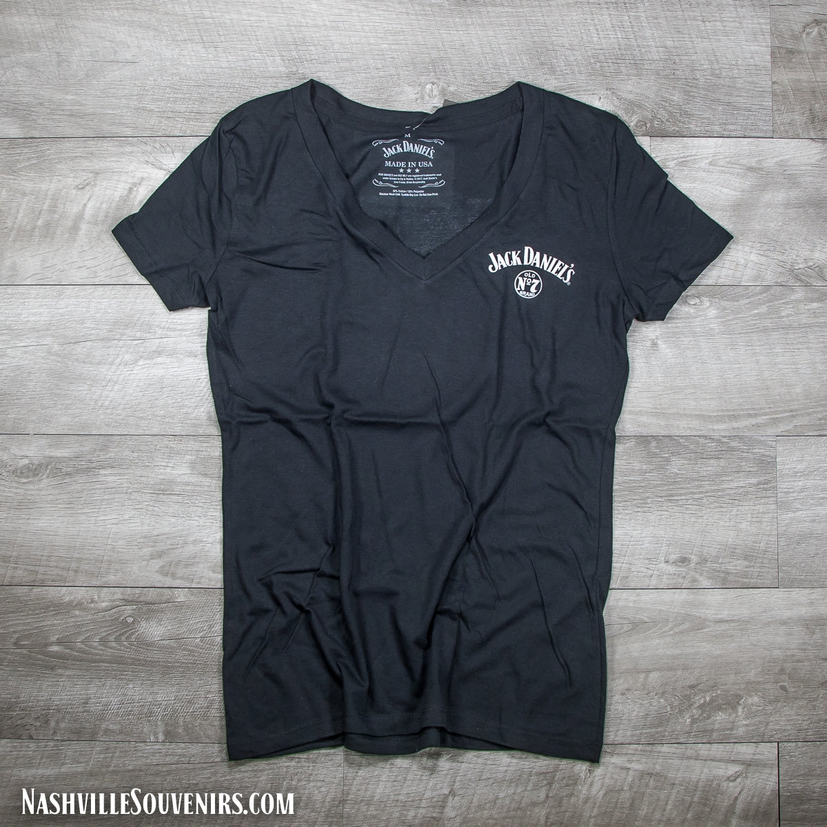Officially licensed ladies Jack Daniels Jack Lives Here V-neck T-Shirt in black. Get yours today with FREE SHIPPING on all US orders over $75!
