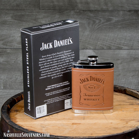 This is a brown officially licensed Jack Daniels Leatherette Flask that is 5 1/4" high and holds 6 oz. A great stainless flask covered in a natural brown leatherette that has the Jack Daniels Tennessee Whiskey bottle label embossed on the front. The flask also comes packaged in a high quality Jack Daniels box making it a