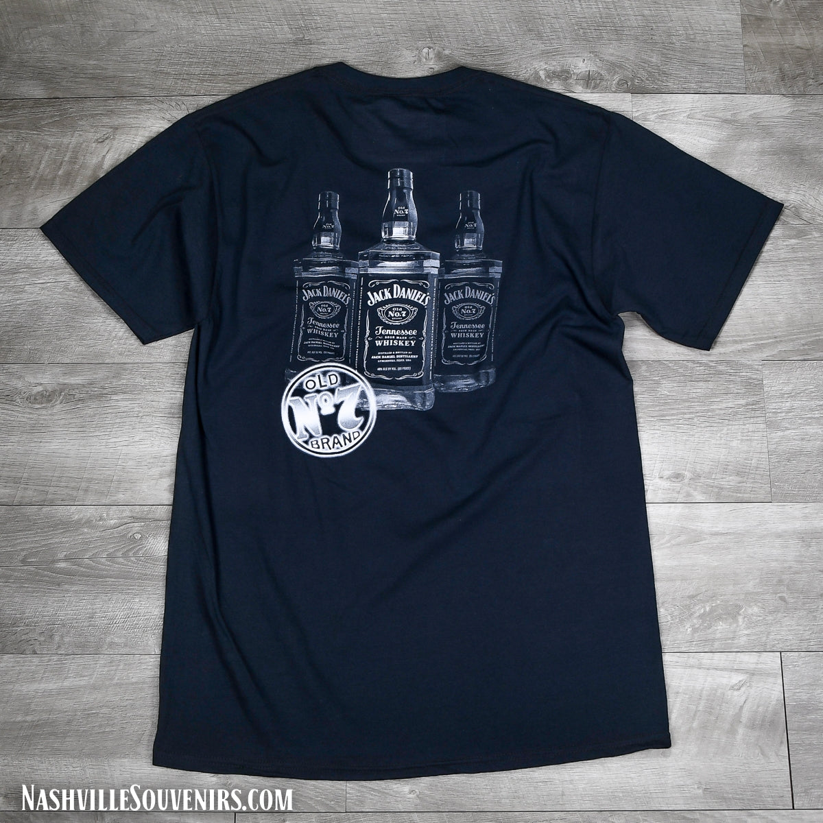 This officially licensed Jack Daniels Bottles T-shirt has a arched Jack Daniels name on the front with three whiskey bottles of Jack on the back. FREE SHIPPING on all US orders over $75!