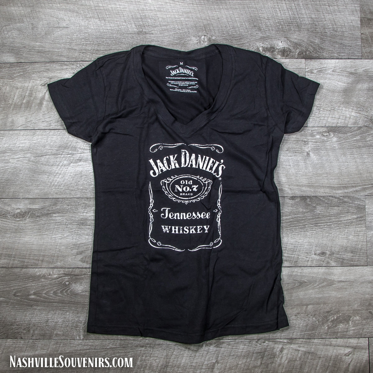 Officially licensed ladies Jack Daniels Bottle Label V-neck T-Shirt in black with white logo. Get yours today with FREE SHIPPING on all US orders over $75!