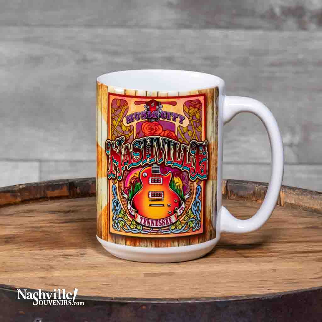 This "Music City" Nashville TN Coffee Mug is a white ceramic mug with an easy to grip handle. The mug features a very colorful wrap around design highlighted by an image of an acoustic guitar.