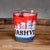 A new design Nashville Skyline Shot glass printed in red, white and blue with a bold "NASHVILLE" in black.