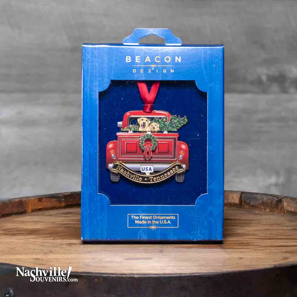 Who doesn't love pickup trucks and dogs? And no ornament collection is complete without our new Nashville "Pickup and Dogs" Collectible Ornament.  It features a red pickup truck complete with two golden retrievers in the bed. Below the dogs and truck you'll find "Nashville Tennessee" etched on a gold banner.