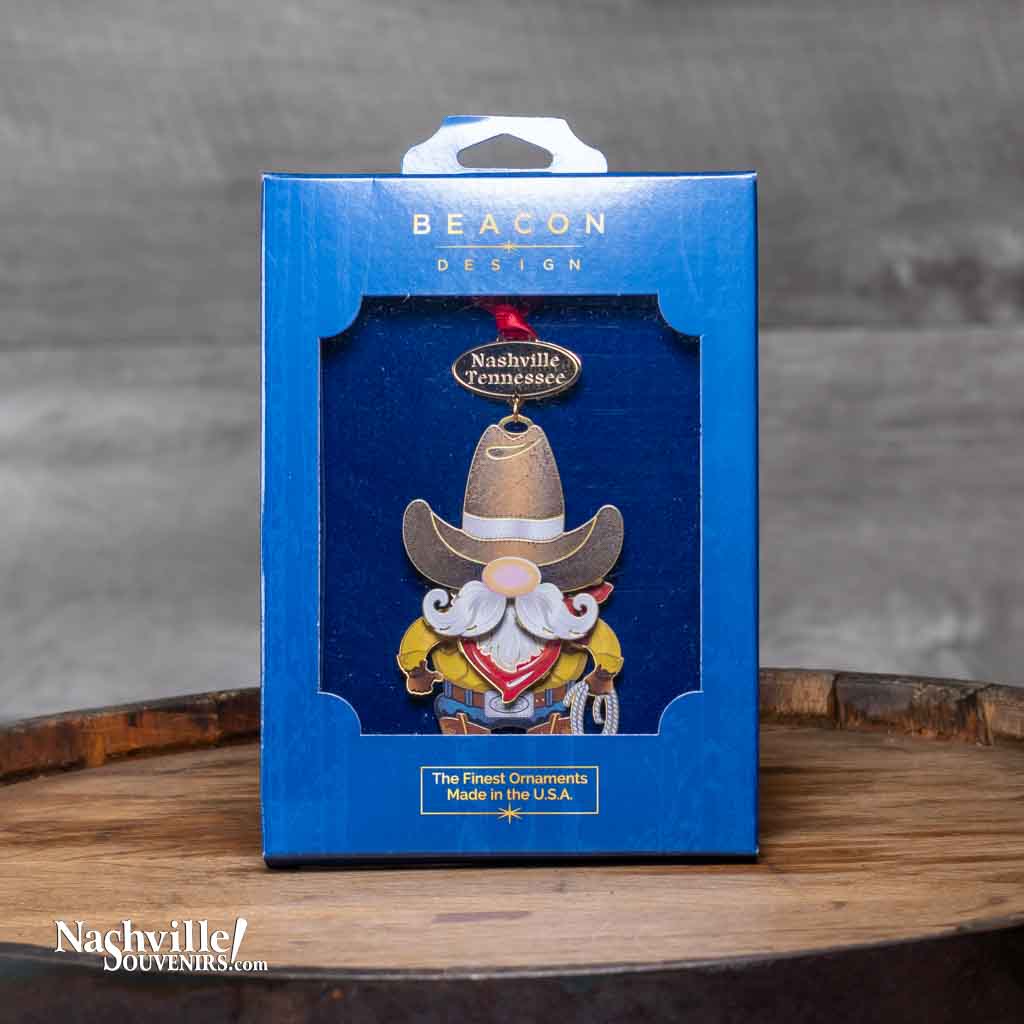 Our new Nashville "Cowboy Gnome" Collectible Ornament features a rough and tumble looking cowboy gnome (Yosemite Sam perhaps?) who looks ready for business. He's hanging from a gold banner etched with "Nashville Tennessee".