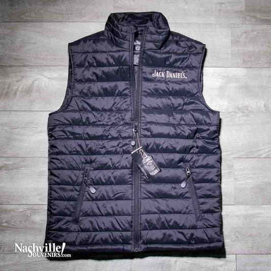 Officially licensed Jack Daniels Puffer Vest is made of soft shell nylon exterior with two front zip-up pockets. Has Jack Daniels logo embroidered logo on the front left chest.