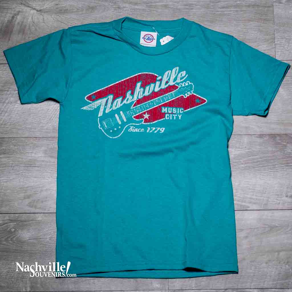 A new design, our youth Nashville "Music City Guitar" T-shirt features a colorful logo with a winged Nashville above an electric guitar. Below the guitar reads, "Music City since 1779" in Jade color.