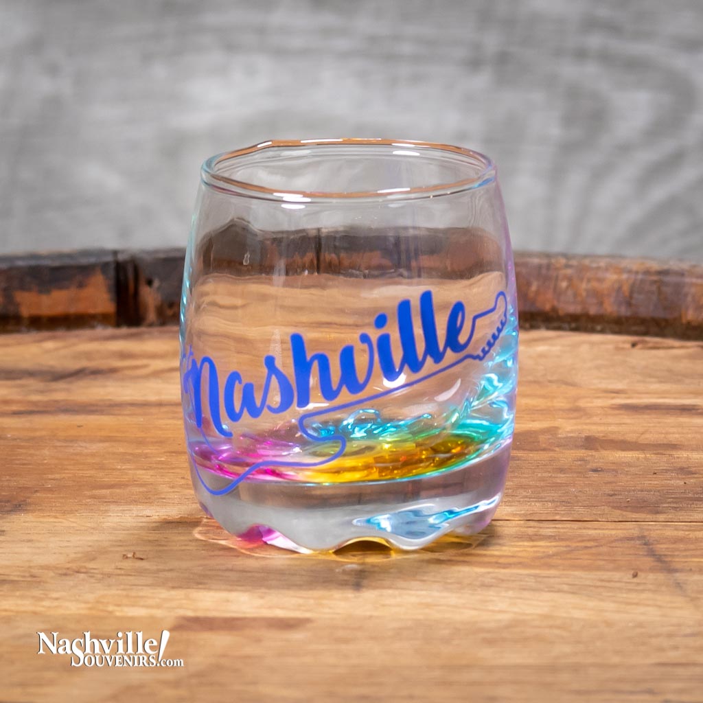 This Nashville Multi-Color Guitar Shot Glass features a bold Nashville logo with guitar and the bottom glass reflects many different colors.