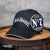 Officially licensed Jack Daniel's "Old No.7 Brand" Hat boast big, bold logos in white against the black background. Look very closely at the front of the brim and you'll find the name "Lynchburg, Tennessee" where this great whiskey is made.