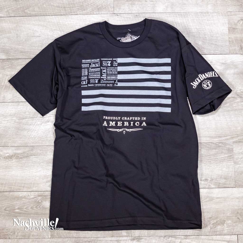 Show some pride in America and the great whiskey brand when you wear the new Jack Daniel's "Crafted in America" T-shirt. This design features a rendition of the American flag in dark gray that contains multiple variations of Jack Daniel logos and sayings.