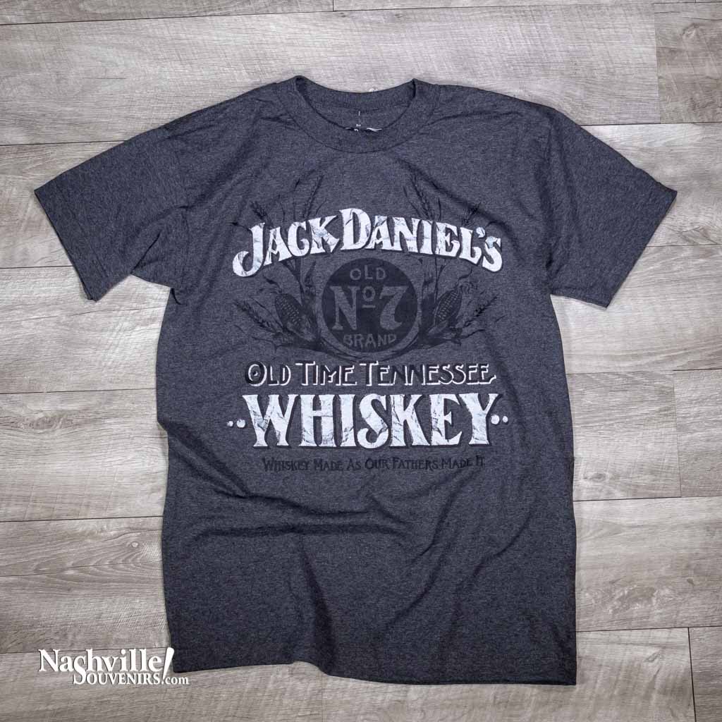 This charcoal grey made in the USA Jack Daniels Old Time Tennessee Whiskey t-shirt is a unique logo design along with the slogan reads "Whiskey made as our fathers made it". The logo's are printed in distressed white typestyle that contrasts beautifully with the dark Old No.7 logo in the background.