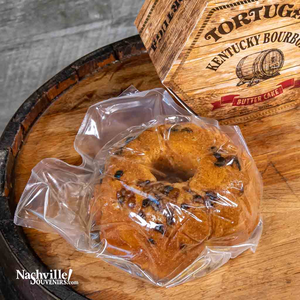 A close up view of a vacuum sealed Tortuga Moonshine Apple Pie cake available from NashvilleSouvenirs.com.