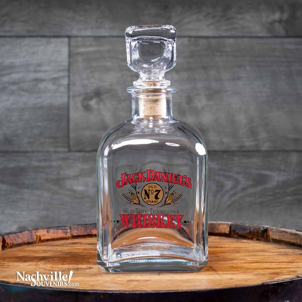 Officially licensed vintage Jack Daniel's "Fine Old Whiskey" Decanter is one of several new decanter designs in a series featuring exact reproductions of vintage Jack Daniel's logos used by the company on their products in days gone by.  This design features the retro Swing and Bug logo flanked by ears of corn.