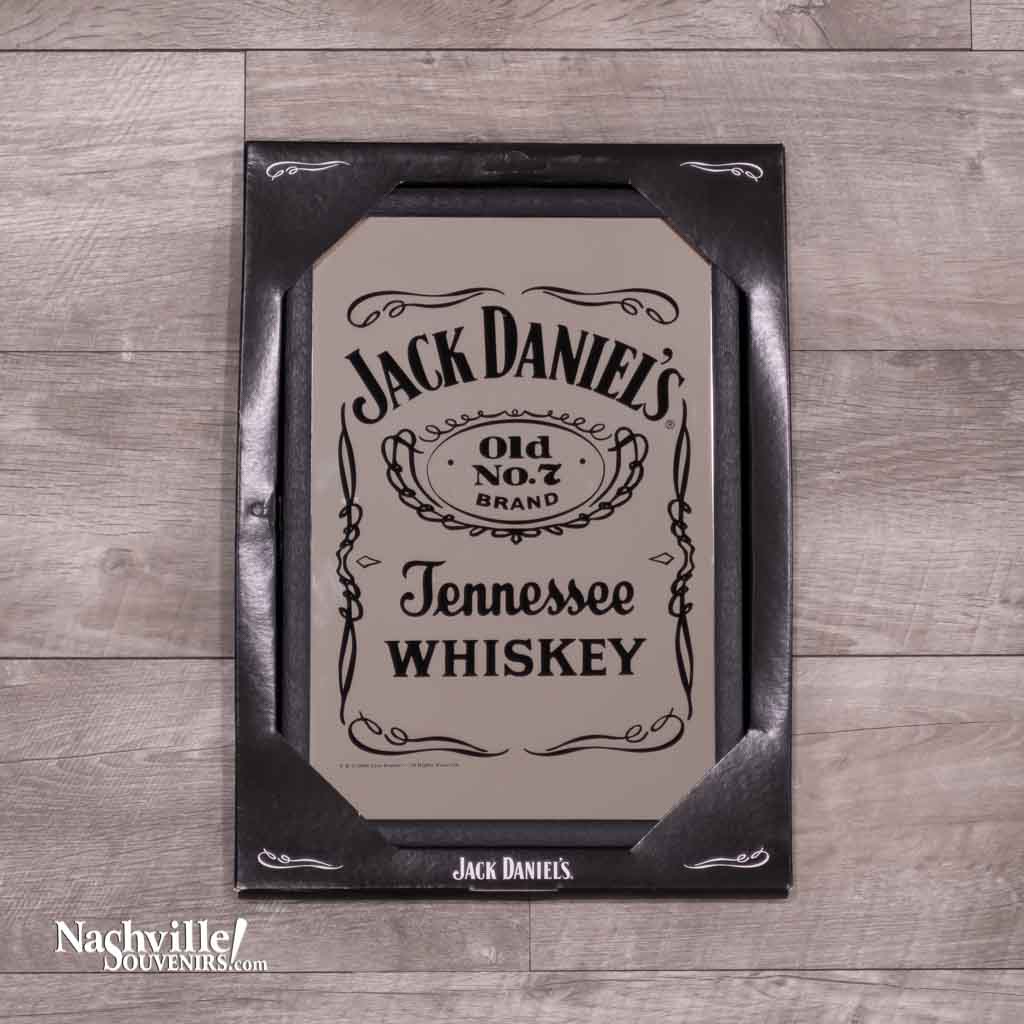 Officially licensed Jack Daniel's "Bottle Label" Mirror with the iconic black label found on the famous whiskey bottle screen printed on a mirror.  The mirror measures 8 1/2" x 12 1/2" and is in a black frame.