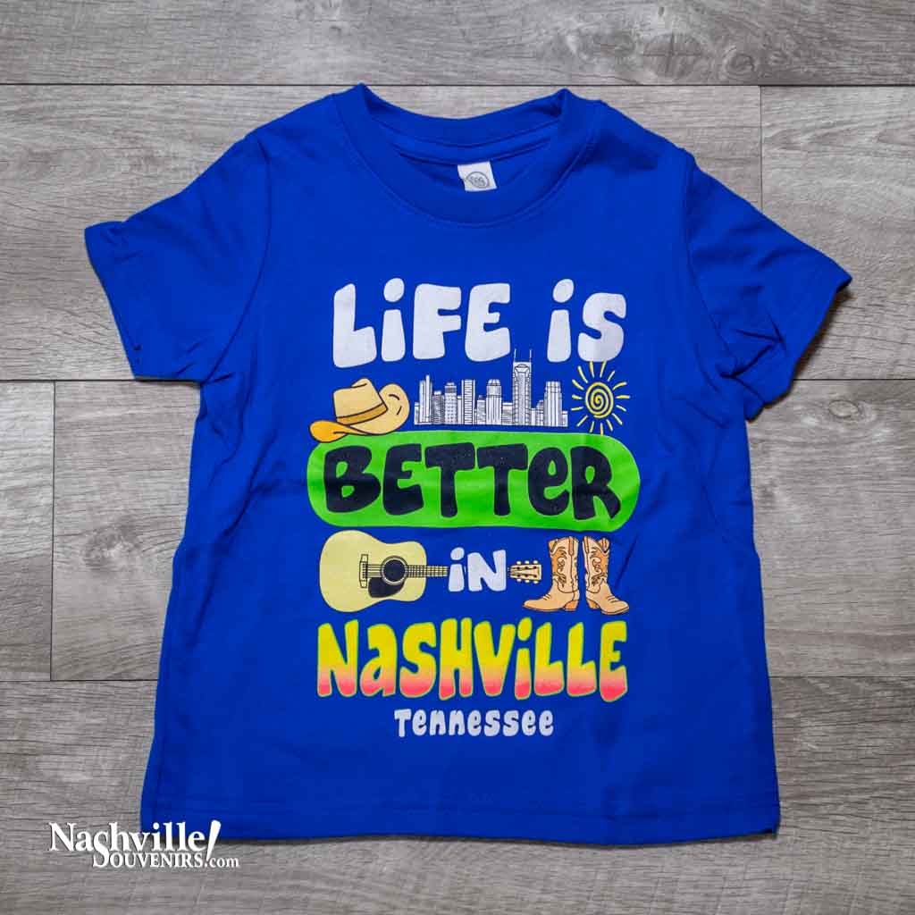 Our new design toddler "Life is Better in Nashville Tennessee" T-Shirt features a colorful logo that includes the Nashville downtown skyline along with a cowboy hat, guitar and boots.  This shirt is available in either Black or Royal Blue and comes in toddlers sizes 2T, 3T and 4T.