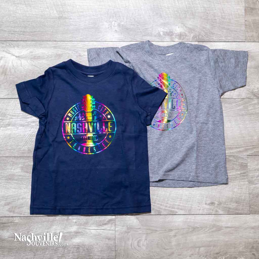 Our new design toddler "Music City Nashville" T-Shirt features a colorful, reflective  logo that includes a multicolor guitar surrounded by music notes.  This shirt is available in either Navy or Granite and comes in toddlers sizes 2T, 3T and 4T.