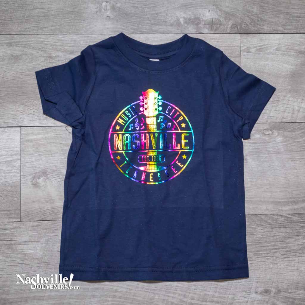 Our new design toddler "Music City Nashville" T-Shirt features a colorful, reflective  logo that includes a multicolor guitar surrounded by music notes.  This shirt is available in either Navy or Granite and comes in toddlers sizes 2T, 3T and 4T.