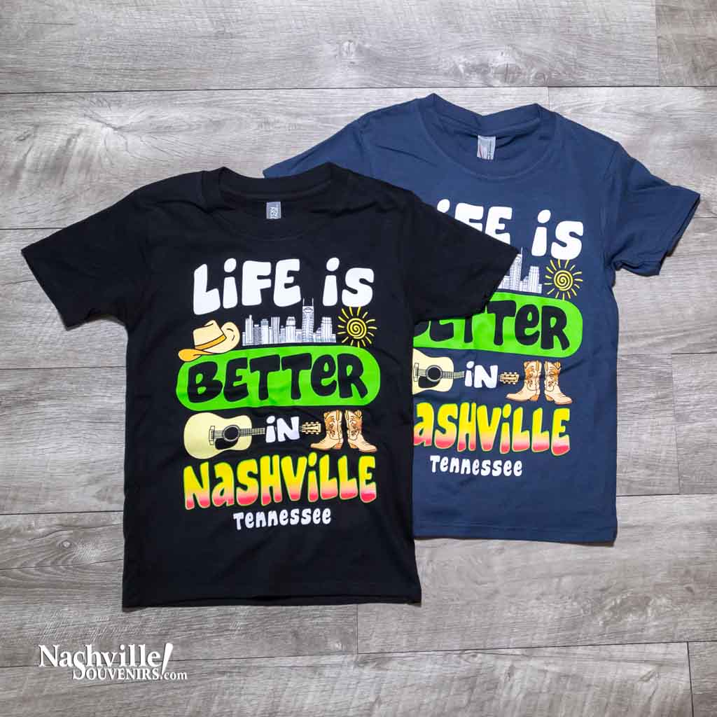 Our new design toddler "Life is Better in Nashville Tennessee" T-Shirt features a colorful logo that includes the Nashville downtown skyline along with a cowboy hat, guitar and boots.  This shirt is available in either Black or Marine Blue and comes in toddlers sizes X-Small, Small, Medium and Large.